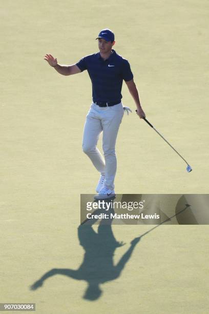 Rory McIlroy of Northern Ireland reacts to his eagle on the 18th green during round two of the Abu Dhabi HSBC Golf Championship at Abu Dhabi Golf...