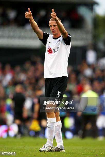 Brede Hangeland celebrates following his team's 2-1 victory during the Barclays Premier League match between Fulham and Everton at Craven Cottage on...