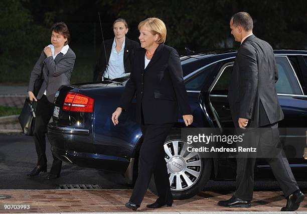 German Chancellor Angela Merkel of the Christian Democratic Union and her personal assistant Beate Baumann arrive at Studio Berlin for the debate...