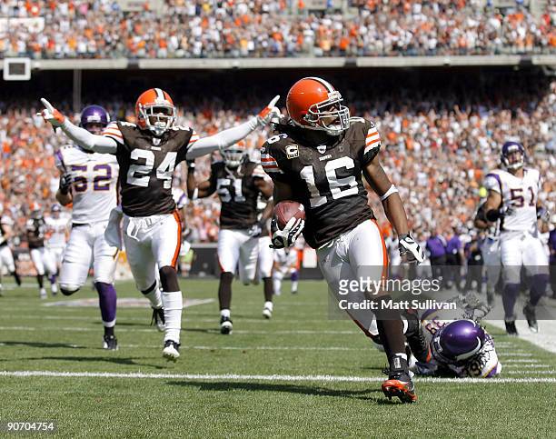 Joshua Cribbs of the Cleveland Browns scores a touchdown as Eric Wright celebrates against the Minnesota Vikings at Cleveland Browns Stadium on...