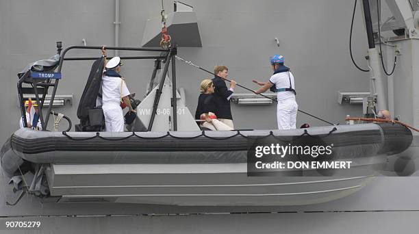 Dutch Prince Willem-Alexander and Princess Máxima are lifted in a launch to the Dutch Naval Frigate HNMLS Tromp as it sails on September 13, 2009 in...