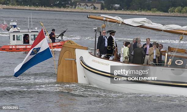 Dutch Prince Willem-Alexander is protected by the US Coast Guard as he sails aboard the traditional Dutch boat Groenevecht on September 13, 2009 in...