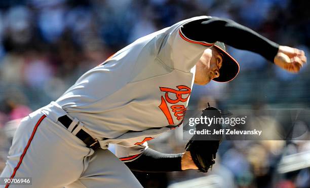Jeremy Guthrie of the Baltimore Orioles delivers to the plate in the first inning of a game against of the New York Yankees at Yankee Stadium on...