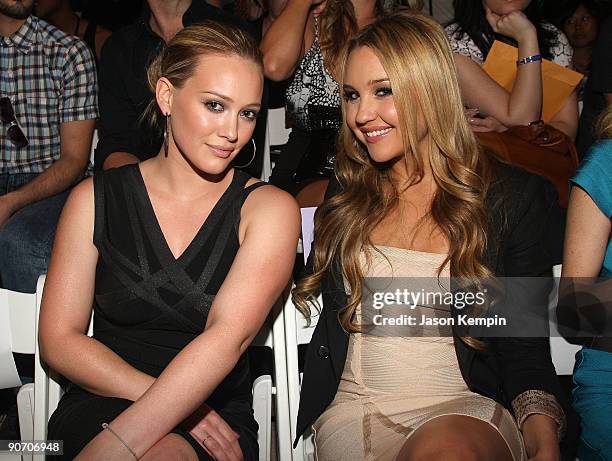 Hilary Duff and Amanda Bynes attend the Herve Leger Spring 2010 Fashion Show at the Promenade at Bryant Park on September 13, 2009 in in New York...