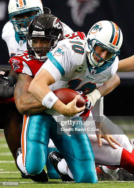 John Abraham of the Atlanta Falcons sacks quarterback Chad Pennington of the Miami Dolphins at Georgia Dome on September 13, 2009 in Atlanta, Georgia.