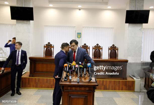 Former Georgian President and ex-governor of the Odessa region of Ukraine Mikheil Saakashvili talks with his lawer, during a court hearing at an...