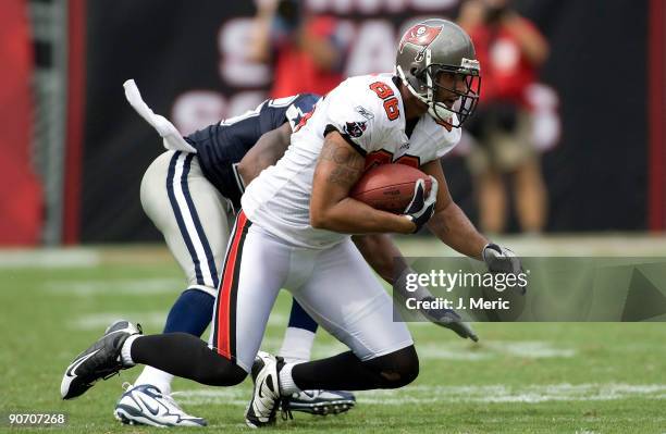 Tight end Jerramy Stevens of the Tampa Bay Buccaneers goes down after a catch against the Dallas Cowboys during the game at Raymond James Stadium on...