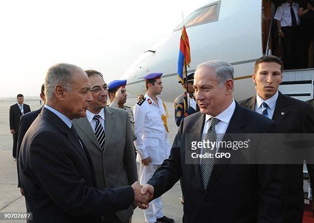 In this handout image supplied by the Israeli Government Press Office , Prime Minister Benjamin Netanyahu is greeted by Egyptian Foreign Minister...