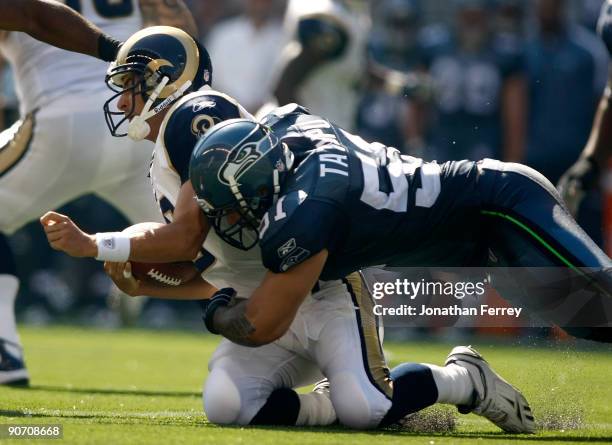 Lofa Tatupu of the Seattle Seahawks sacks Marc Bugler of the St. Louis Rams at Qwest Field on September 13, 2009 in Seattle, Washington.