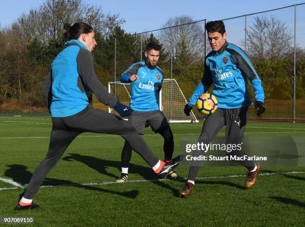 Hector Bellerin, Mathieu Debuchy and Konstantinos Mavropanos of Arsenal during a training session at London Colney on January 19, 2018 in St Albans,...