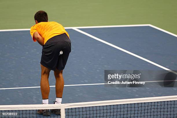 Novak Djokovic of Serbia ducks a return from Roger Federer of Switzerland during the Men�s Singles Semifinal match on day fourteen of the 2009 U.S....