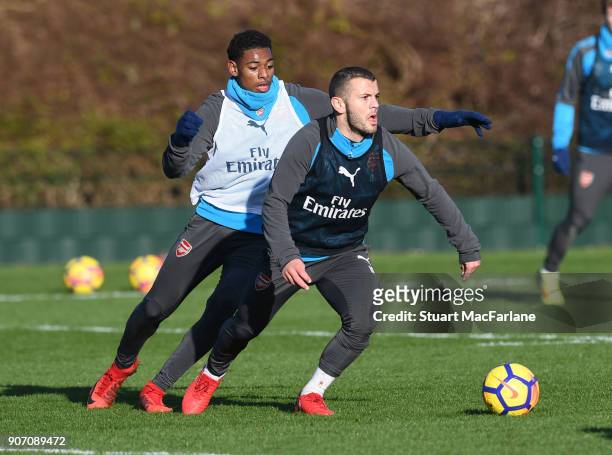 Jeff Reine-Adelaide and Jack Wilshere of Arsenal during a training session at London Colney on January 19, 2018 in St Albans, England.