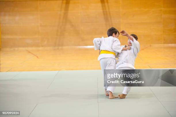 two boys training judo - judo kids stock pictures, royalty-free photos & images