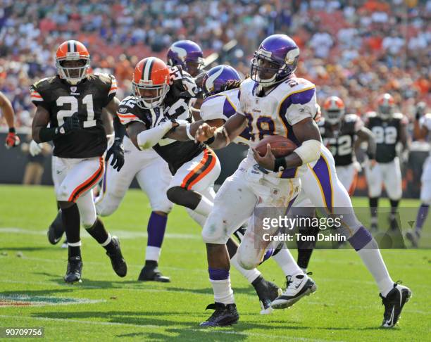 Adrian Peterson of the Minnesota Vikings carries the ball during an NFL game against the Cleveland Browns, September 13 at Cleveland Browns Stadium...