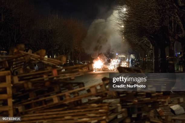 Wooden palettes burn as prison guards block access to Fresnes prison on January 19, 2018 to demand tighter security. French prison officers blocked...