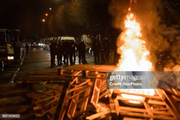 Wooden palettes burn as prison guards block access to Fresnes prison on January 19, 2018 to demand tighter security. French prison officers blocked...