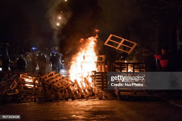 Wooden palettes burn as prison guards block access to Fresnes prison on January 19, 2018 to demand tighter security. French prison officers blocked...