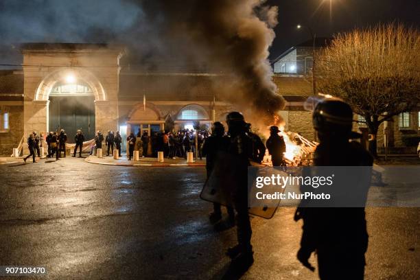 Wooden palettes burn as prison guards block access to Fresnes prison on January 19, 2018 to demand tighter security. French prison officers blocked...