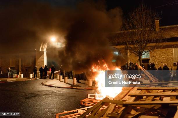 Wooden palettes burn as prison guards block access to Fresnes prison on January 19, 2018 to demand tighter security. French prison officers blocked...