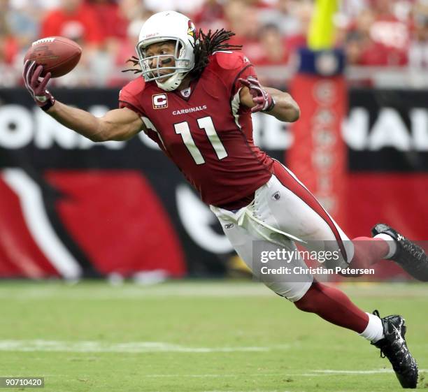 Wide receiver Larry Fitzgerald of the Arizona Cardinals is unable to catch a pass during the NFL game against the San Francisco 49ers at the...