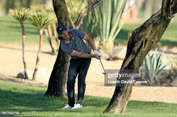 Tommy Fleetwood of England plays his second shot on the par 4, 16th hole during the second round of the 2018 Abu Dhabi HSBC Golf Championship at the...