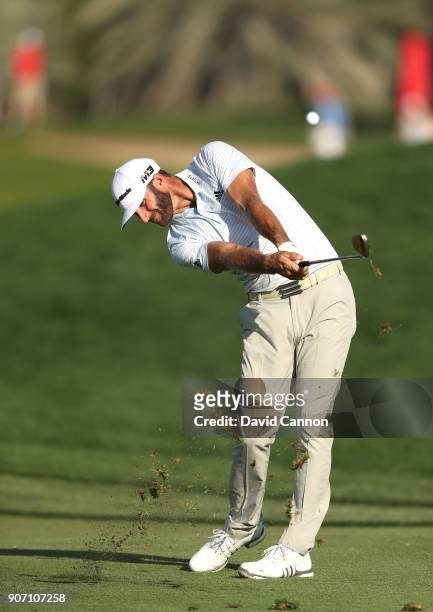 Dustin Johnson of the United States plays his second shot on the 16th hole during the second round of the 2018 Abu Dhabi HSBC Golf Championship at...
