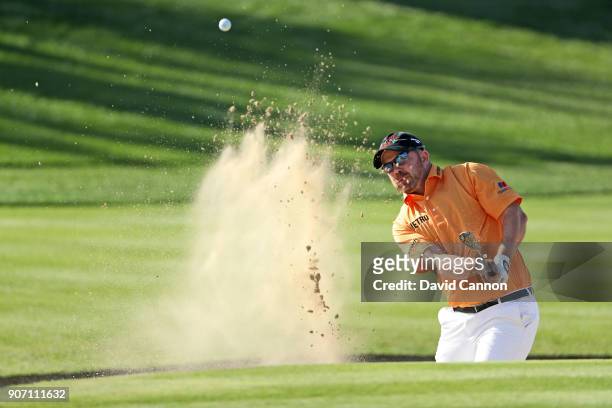 Richie Ramsay of Scotland plays his third shot on the par 5, second hole during the second round of the 2018 Abu Dhabi HSBC Golf Championship at the...