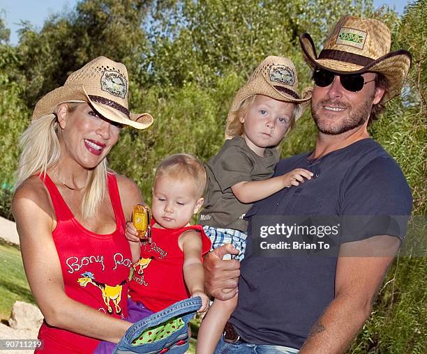 Actress Tori Spelling , daughter Stella McDermott, son Liam McDermott, and actor Dean McDermott pose at The Bony Pony Ranch Foundation At-Risk...