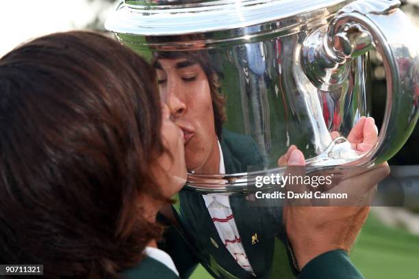 Rickie Fowler of the USA celebrates with the trophy after the USA team had secured victory during the final afternoon singles matches on the East...