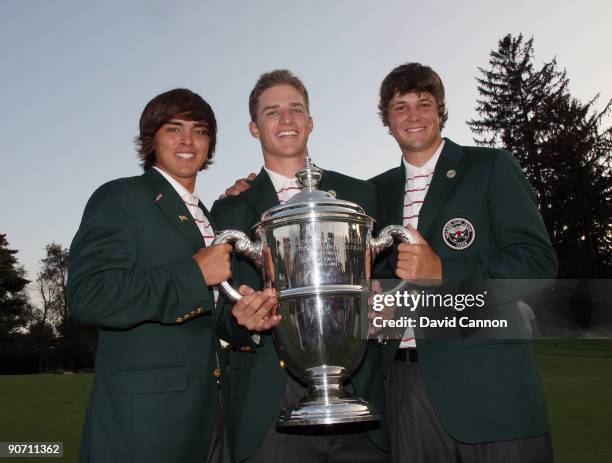 Rickie Fowler, Morgan Hoffman and Peter Uihlein of the USA with the trophy after the USA had won the match, all are members of the Oklahoma State...