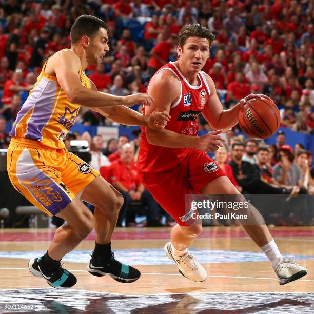 Damian Martin of the Wildcats controls the ball against Kevin Lisch of the Kings during the round 15 NBL match between the Perth Wildcats and the...