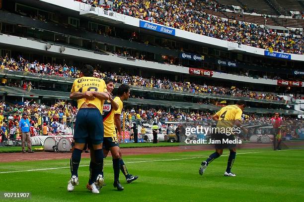 Salvador Cabanas, Angel Reyna and Pavel Pardo of Aguilas del America celebrate a goal against Edtudiantes Tecos during their match for the 2009...