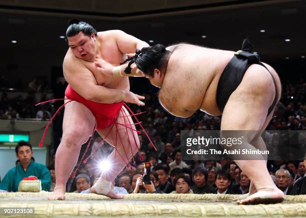 Komusubi Ononsho throws ozeki Takayasu to win during day six of the Grand Sumo New Year Tournament at Ryogoku Kokugikan on January 19, 2018 in Tokyo,...