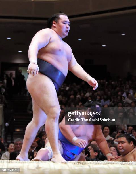 Mongolian yokozuna Kakuryu reacts after beating Kotoshogiku during day six of the Grand Sumo New Year Tournament at Ryogoku Kokugikan on January 19,...