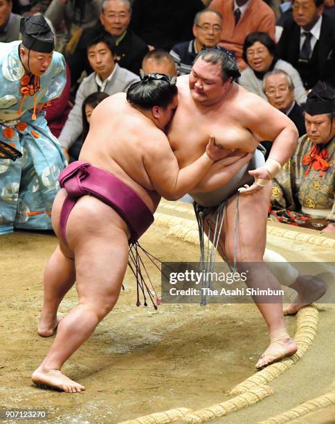 Sekiwake Mitakeumi pushes Hokutofuji out of the ring to win during day six of the Grand Sumo New Year Tournament at Ryogoku Kokugikan on January 19,...