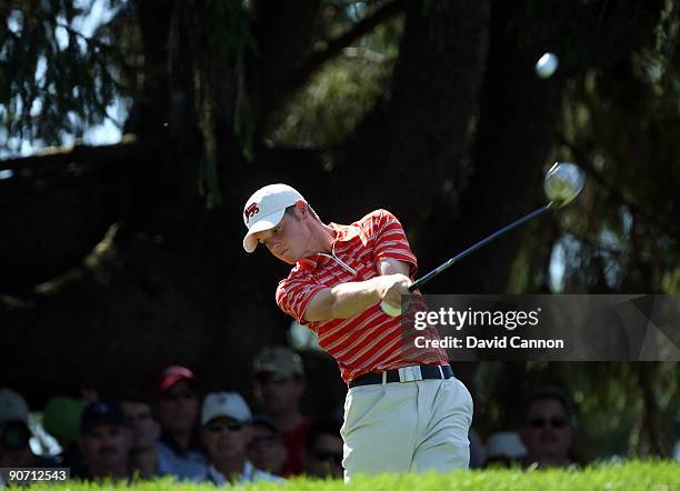 Sam Hutsby of England and the Great Britain and Ireland Team tees off at the 3rd hole against Drew Weaver of the USA during the final afternoon...