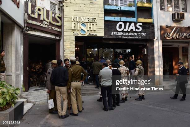 Police, SMCD officials and shopkeepers stand during the MCD conducting sealing drive at Sundar Nagar Market, on January 19, 2018 in New Delhi, India....