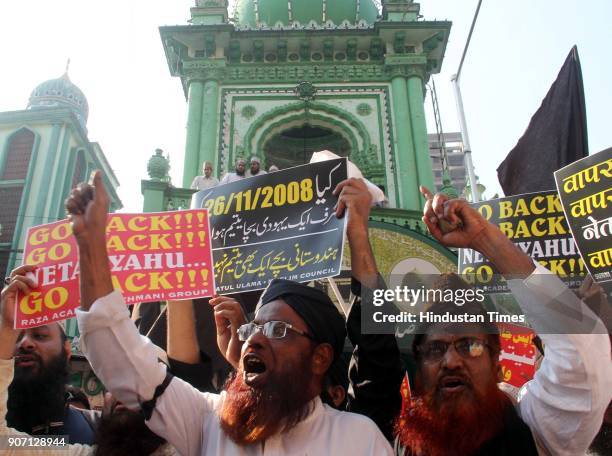 Muslim Community and Maulana's shout slogans and hold placards and protest against the visit of Israel Prime Minister Benjamin Netanyahu, outside...