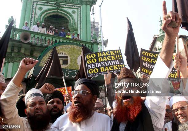 Muslim Community and Maulana's shout slogans and hold placards and protest against the visit of Israel Prime Minister Benjamin Netanyahu, outside...