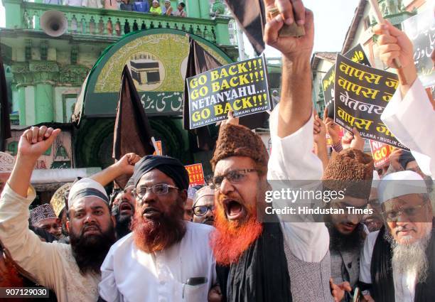 Muslim Community and Maulana's shout slogans and hold placards and protest against the visit of Israel Prime Minister Benjamin Netanyahu, outside...