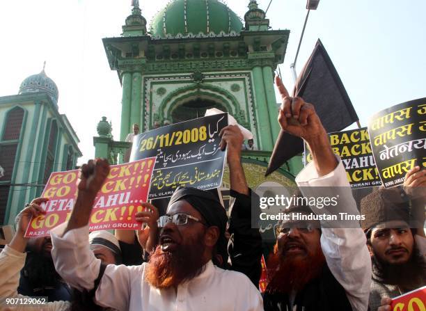 Muslim Community and Maulana's shout slogans and hold placards and protest against the visit of Israel Prime Minister Benjamin Netanyahu, outside...