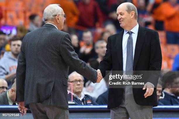 Head coach Jim Boeheim of the Syracuse Orange and head coach Kevin Stallings of the Pittsburgh Panthers shake hands following the game at the Carrier...