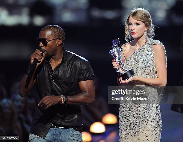 Kanye West takes the microphone from Taylor Swift and speaks onstage during the 2009 MTV Video Music Awards at Radio City Music Hall on September 13,...