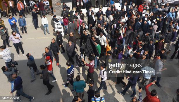 Local shopkeepers protest and shout slogans against the sealing drive in South Extension market, on January 19, 2018 in New Delhi, India. Traders'...