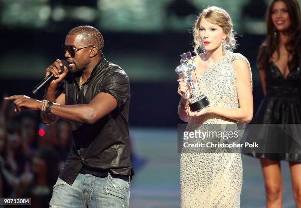 Kanye West jumps onstage after Taylor Swift won the "Best Female Video" award during the 2009 MTV Video Music Awards at Radio City Music Hall on...