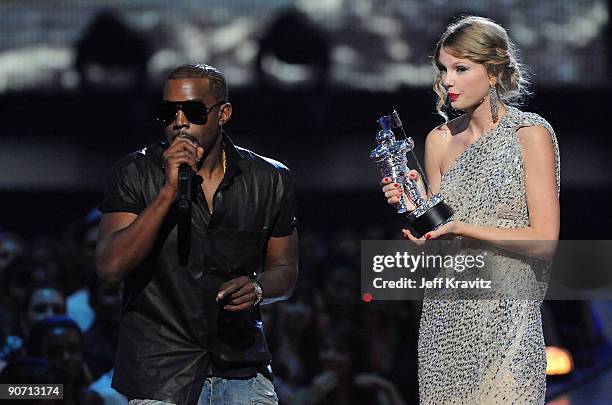 Kanye West jumps onstage as Taylor Swift accepts her award for the "Best Female Video" award during the 2009 MTV Video Music Awards at Radio City...