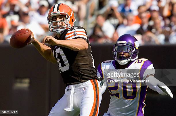 Brady Quinn of the Cleveland Browns passes against Madieu Williams the Minnesota Vikings on September 13, 2009 at Cleveland Browns Stadium in...