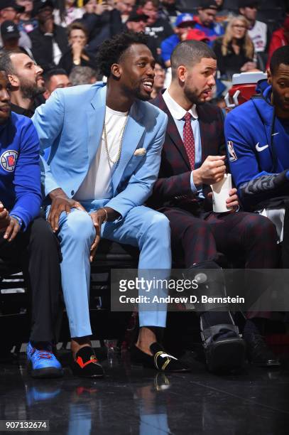 Patrick Beverley and Austin Rivers of the LA Clippers sit on the bench during the game against the Denver Nuggets on January 17, 2018 at STAPLES...