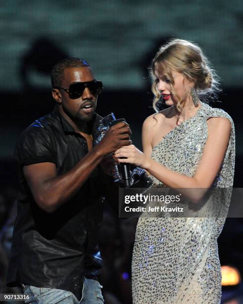 Kanye West jumps onstage as Taylor Swift accepts her award for the "Best Female Video" award during the 2009 MTV Video Music Awards at Radio City...