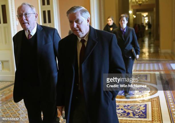 Sen. Lindsey Graham and Sen. Lamar Alexander depart Majority Leader Mitch McConnell's office following a meeting January 19, 2018 in Washington, DC....